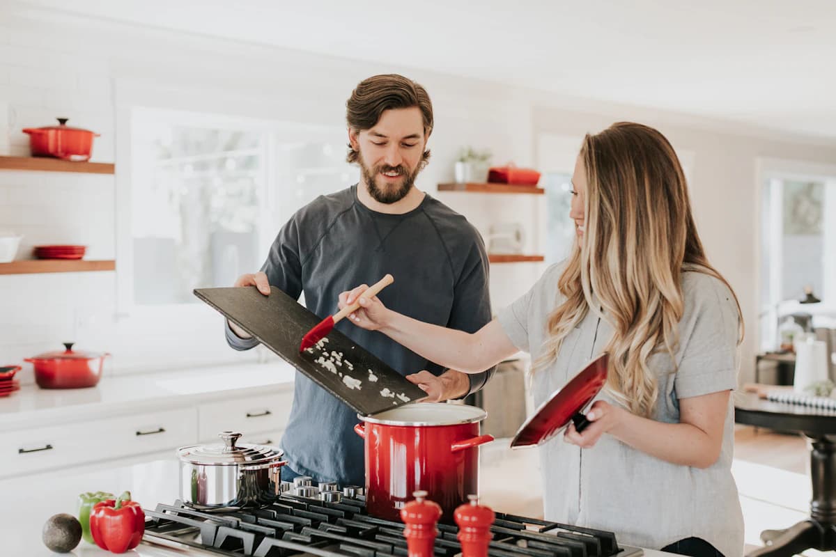 A couple comparing quality cookware at Oreste Utensils