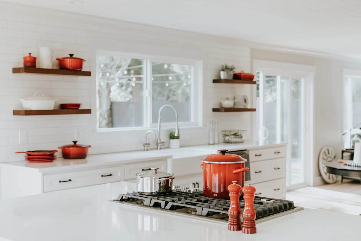 A bright kitchen styled with cookware from Oreste Utensils
